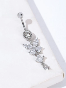 Macro shot of silver butterfly belly ring with AAA cubic zirconia dangles and metal shine