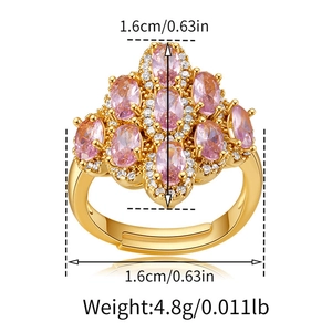 Detail view of gold adjustable ring with pink oval gemstones and size measurements