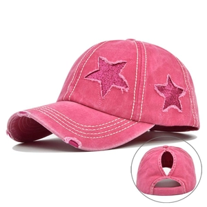Detail of rose pink washed baseball cap with glitter star patches and ponytail hole
