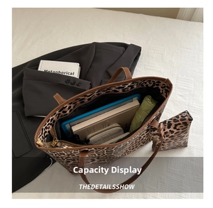 Internal view of leopard print tote bag showing large capacity and matching coin purse