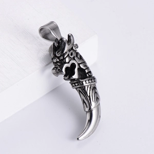Retro titanium steel wolf tooth pendant with dragon head carving on white wood