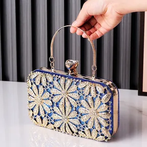 Elegant blue glitter evening clutch bag with gold floral rhinestone pattern and metal handle