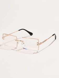 Detail view of rimless square sunglasses with gold metal bridge and gradient lenses