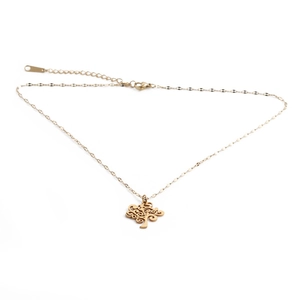 Golden stainless steel tree of life pendant necklace with adjustable chain on white background