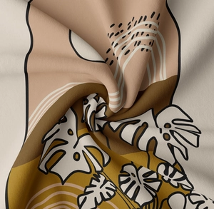 Close-up of bohemian monstera leaf print on soft textured fabric with abstract earth tones