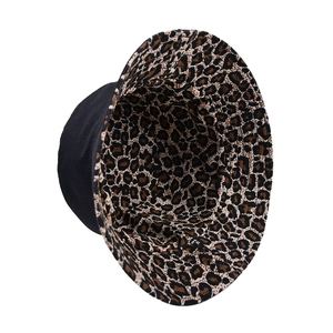 Reversible leopard print and black bucket hat for sun protection in a stylish street design