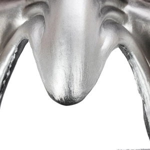 Detailed macro view of a silver mask featuring antique finish and 3D textured surface