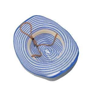 Detail of blue and white striped straw hat with adjustable brown chin strap and sweatband