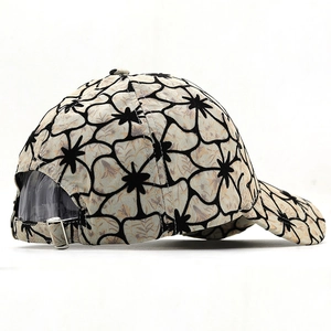 Rear view of floral print baseball cap featuring an adjustable silver metal buckle