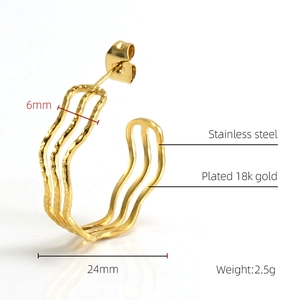 Detail view of 18k gold plated stainless steel wave earrings with 24mm diameter size specs