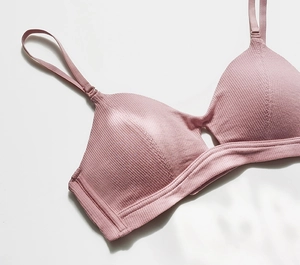Close-up of ribbed knit bralette with adjustable thin straps in dusty rose pink color