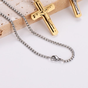 Retro hip hop necklace featuring a gold cross pendant with Jesus relief on silver chain