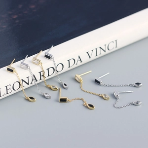 Detailed close-up of S925 sterling silver geometric tassel earrings with zircon stones