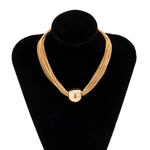 Detail of layered gold chain choker featuring a smooth spherical pendant on a black bust