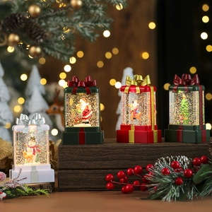 Luminous Christmas gift box water globes with snowman and Santa for festive tabletop decor
