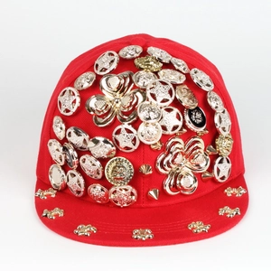 Red hip hop snapback baseball cap with gold rivets and Medusa style metal studs