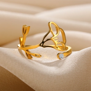 Detail of gold floral open ring with ginkgo leaf design and clear zircon stone