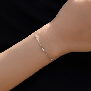 Elegant 925 sterling silver chain bracelet with sparkling cubic zirconia on a wrist