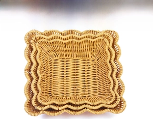 Macro detail of three-piece hand-woven imitation rattan baskets with wavy edges