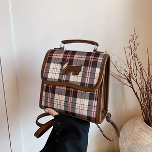 Vintage brown and pink plaid backpack featuring a cute dachshund dog embroidery detail