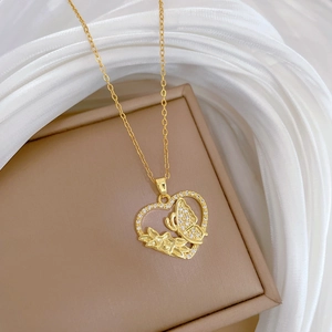Elegant gold titanium steel heart and butterfly necklace with crystals on jewelry box