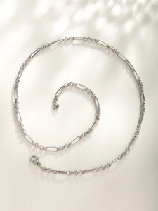 Detailed view of silver-plated link necklace featuring a minimalist geometric design
