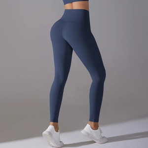 Detail of high-waisted yoga pants showing the V-shaped butt lift seam and fabric texture
