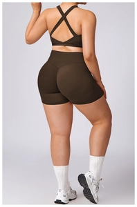 Detail of high waist brown yoga shorts with V-shaped stitching for a butt-lifting effect