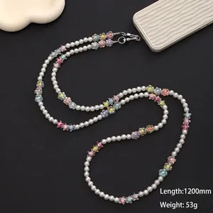 Detail of 1200mm crossbody phone strap with white pearls and acrylic colorful flowers
