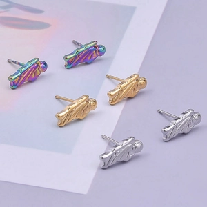 Detail of angel-shaped stud earrings in rainbow, gold, and silver finishes