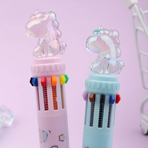 Close-up of pink and blue multi-color ballpoint pens with unicorn top and star patterns