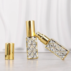 Elegant 12ml glass perfume spray bottles with gold diamond pattern and metallic caps