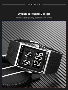 Macro shot of silver stainless steel case and black textured rubber strap on digital watch