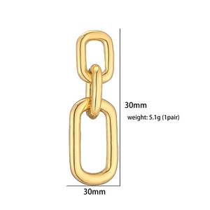 Detail shot of 18K gold plated hollow heart drop earrings with size measurement of 30mm