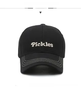 Detail of black baseball cap with Pickles embroidery and white contrast brim stitching