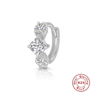 Detailed macro view of S925 sterling silver hoop earring with cubic zirconia accents