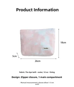 Detail view of tie-dye wash bag showing dimensions 26x18x5cm with durable zipper closure