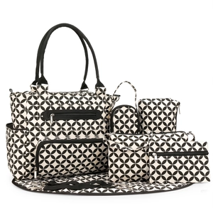 Close-up of 7-piece diaper bag set with black and white geometric circular patterns