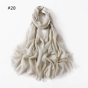 Elegant silver metallic glitter scarf for women featuring a natural frayed edge finish