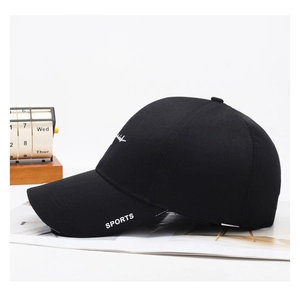 Close-up of black sports baseball cap with white SPORTS print and embroidered logo details
