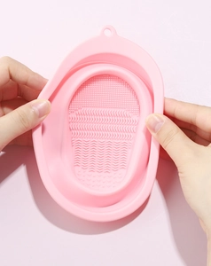 Detail of pink silicone makeup brush cleaning bowl showing textured surface for deep cleaning