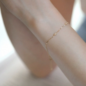 Elegant gold S925 sterling silver heart bracelet with sparkling diamonds on female wrist