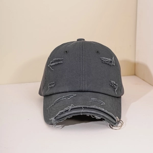 Distressed dark gray cotton baseball cap with two metal rings on the brim and vintage holes