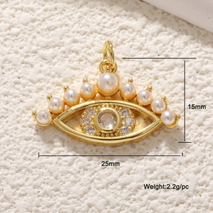 Detail of a 15mm x 25mm evil eye pendant with gold plating, pearls, and zircons