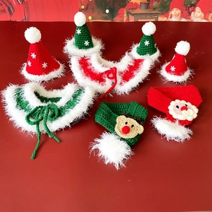 Macro view of Christmas pet knit set featuring handmade Santa and reindeer crochet patterns