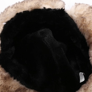 Detailed macro view of 100% polyester thick faux fur lining on a winter aviator hat