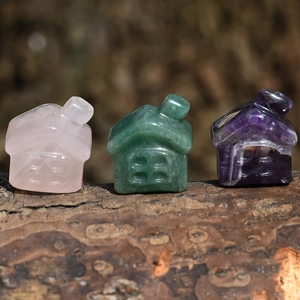Natural crystal house carvings in rose quartz, aventurine, and amethyst on wood base