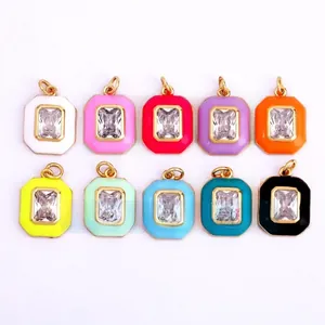 Flat lay of colorful octagonal pendants with enamel borders and rectangular zircons