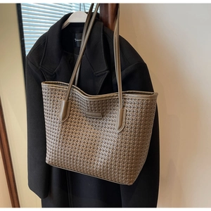 Detailed view of khaki woven PU leather tote bag with elegant thin shoulder straps