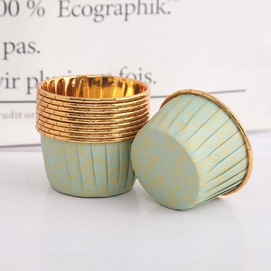 Detail of oil-proof gold-leaf baking cups with metallic inner coating and pleated design